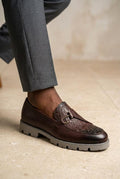 Brown embossed leather slip-on loafers