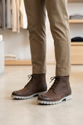 Leather lace-up boots resemble casual cap-toe boots