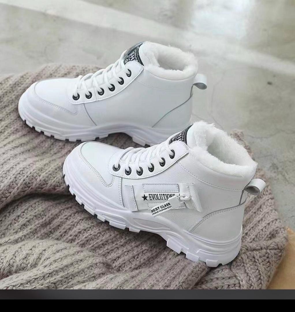 white ankle snow boots feature a lace-up design ladies