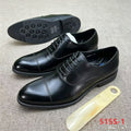 black leather cap-toe Oxford dress shoes