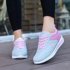 women's fashion sneakers feature a grey and pink design with a lace-up