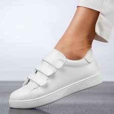 white sneakers feature a convenient three-strap hook-and-loop
