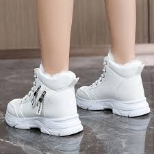 white ankle snow boots feature a lace-up design ladies
