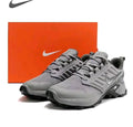 Grey Nike Fast X runner sneakers