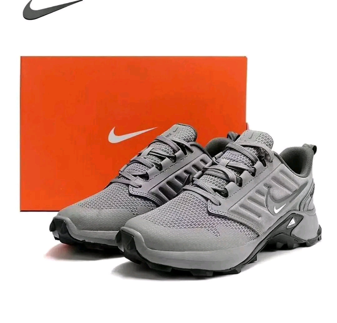 Grey Nike Fast X runner sneakers