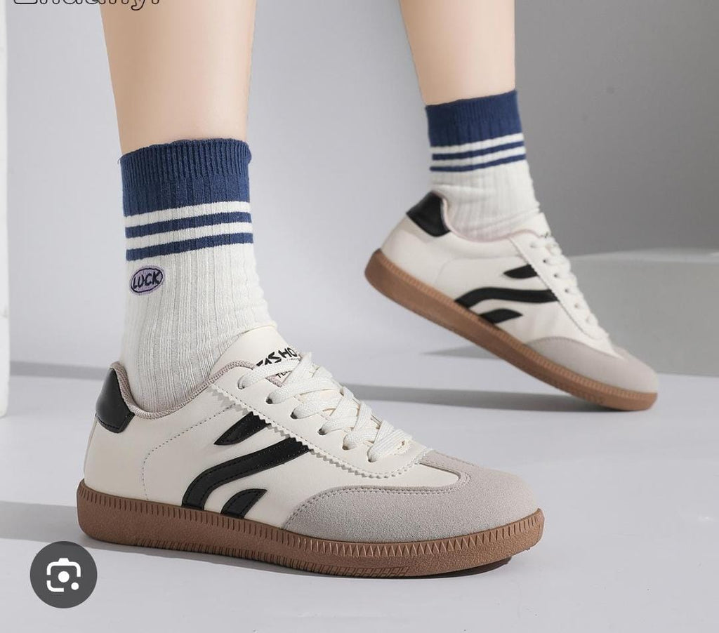 Retro-style, low-top white fashion sneakers