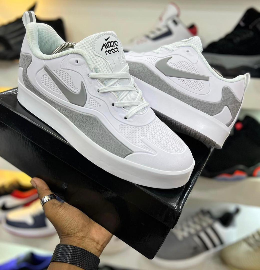 White and grey low-top Nike casual sneakers