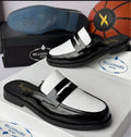 Two-tone black and white patent leather penny loafer