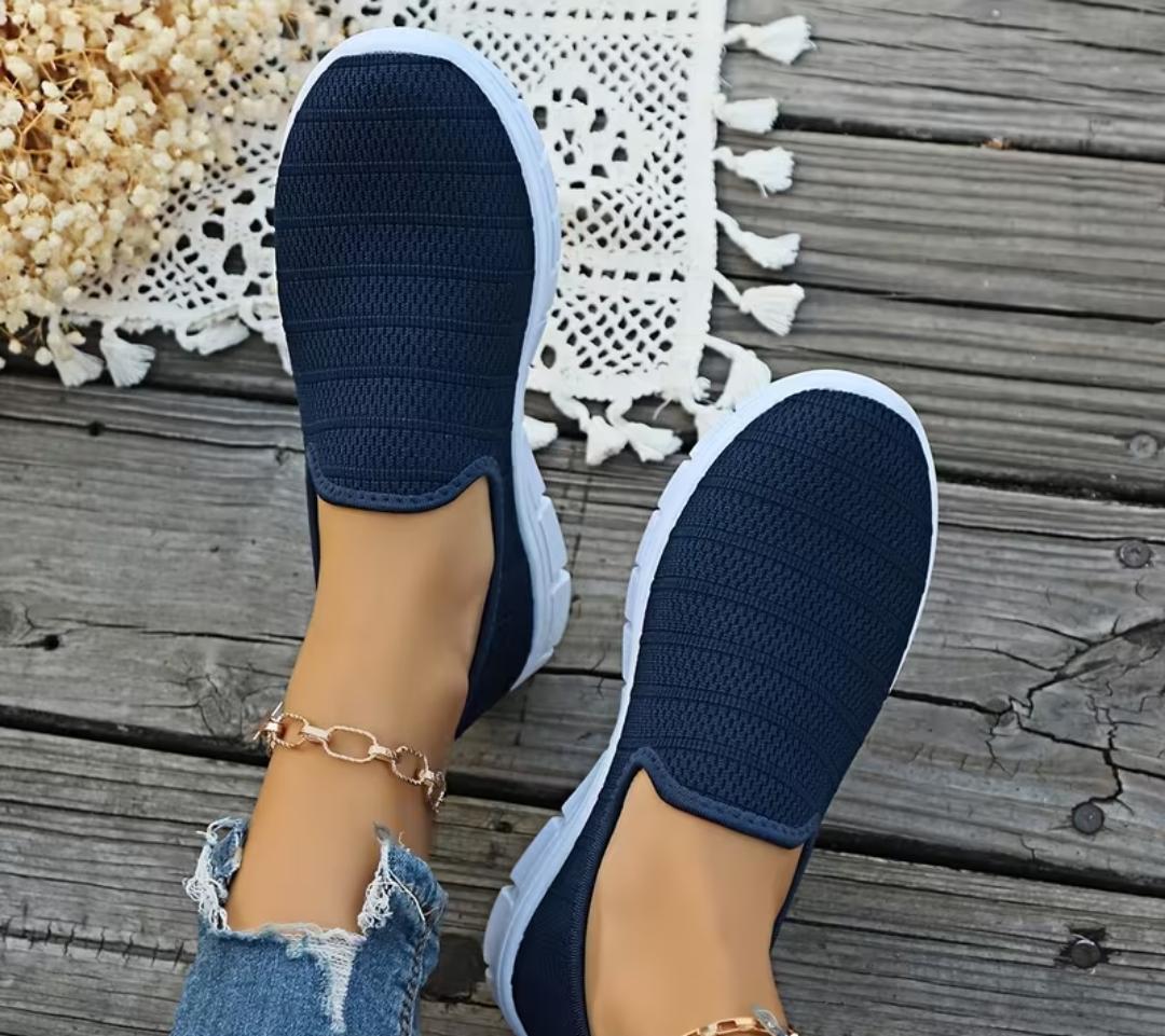 Navy blue slip-on knit walking shoe