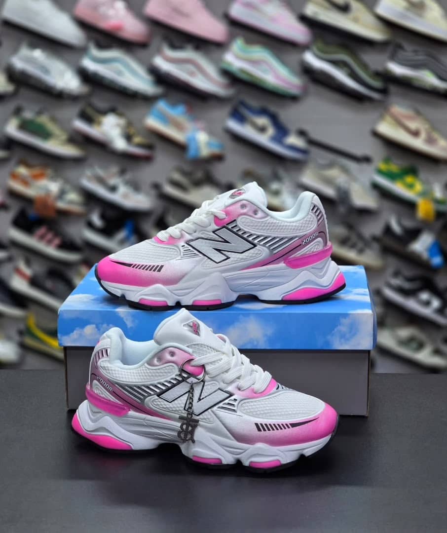 New Balance 1000 sneakers, known for their white and vibrant pink