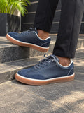 Dark blue or navy low-top casual leather and suede sneakers