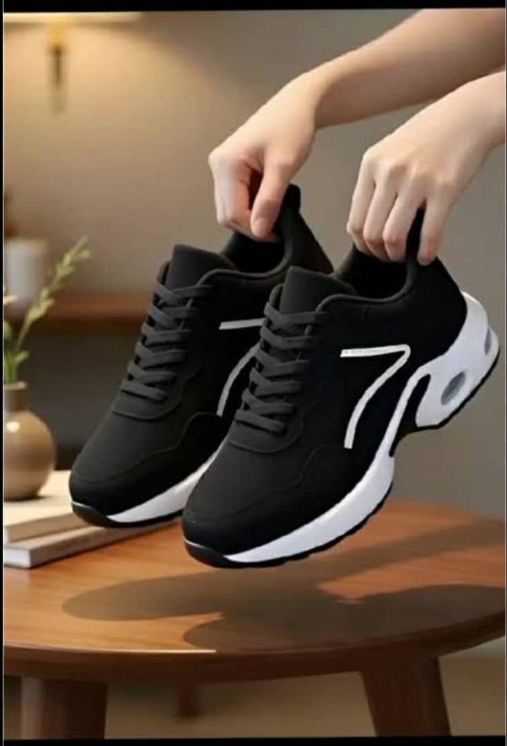 black and white sneakers appear to be similar to SHEIN Women's Air Cushion