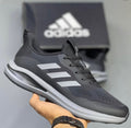Black and grey Adidas running sneakers