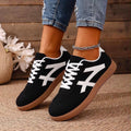 Black retro-style low-top fashion sneakers