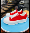 Red and white low-top platform sneakers