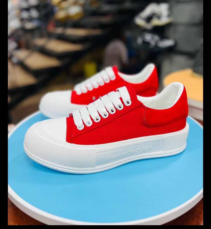 Red and white low-top platform sneakers