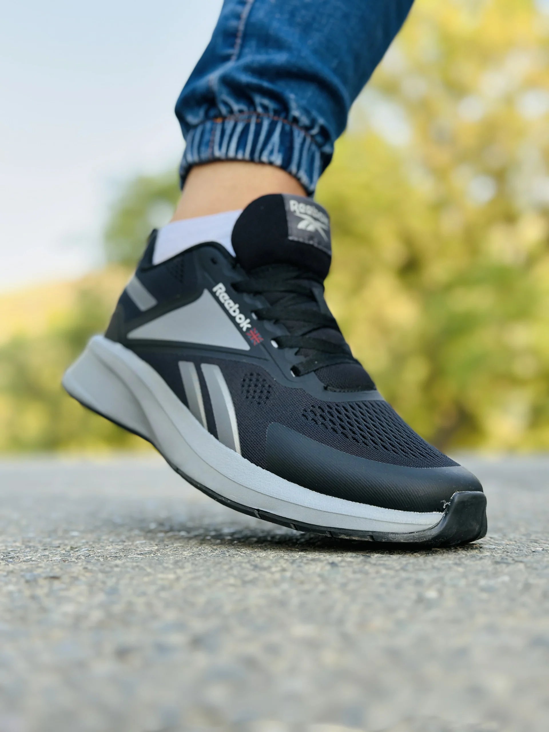 Black and grey Reebok mesh trainer running sneakers
