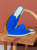 Vibrant electric blue nubuck crocodile mules