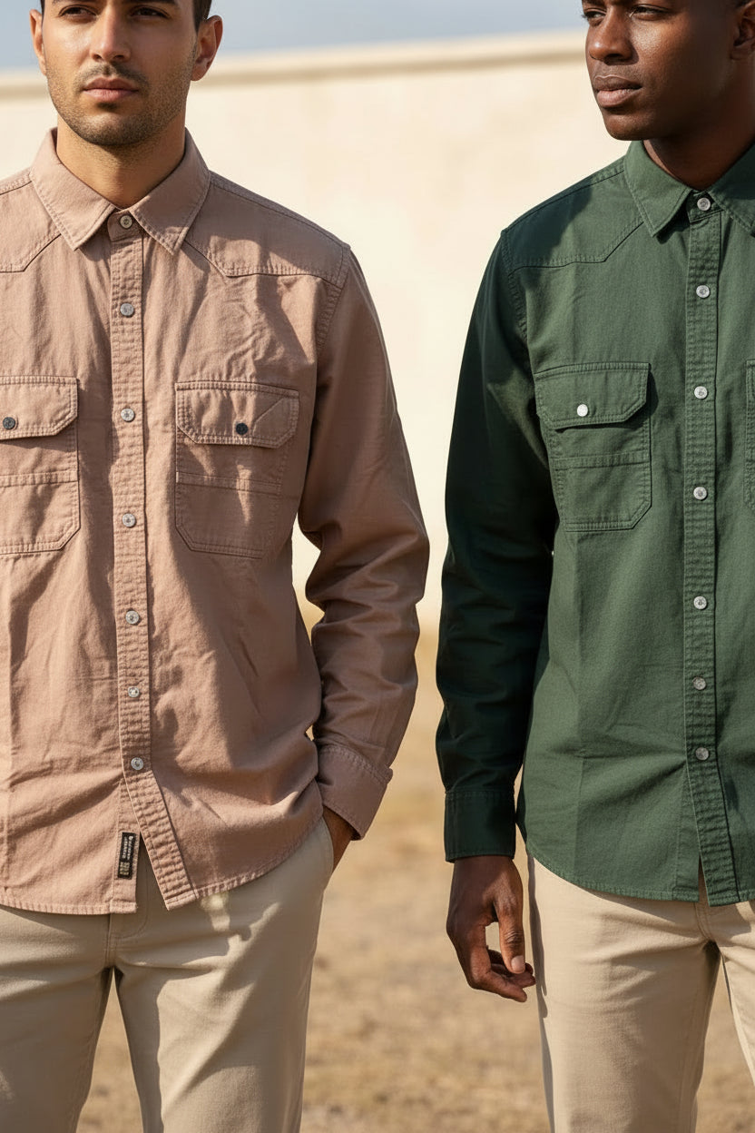 Two long-sleeved, button-up cotton or linen-blend utility shirts