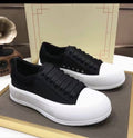 Black and white platform sneakers