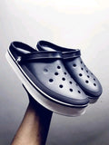 Black and white platform version of the Crocs Off Court Clog