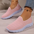 Lightweight pink knit slip-on walking sneakers