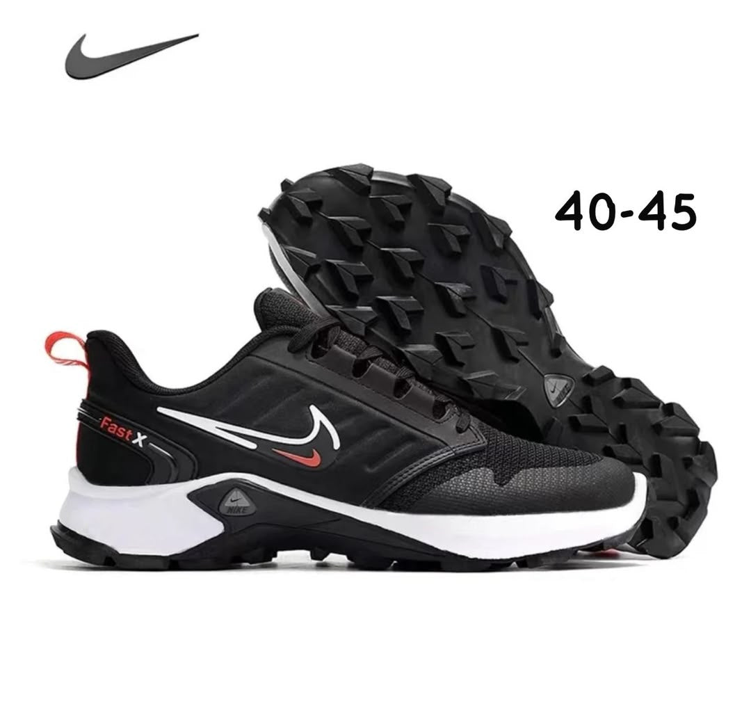 Nike Fast X sneakers featuring a prominent black and white design