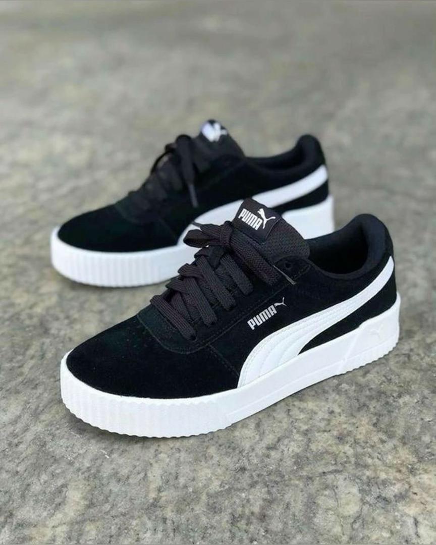 Black and white Puma Carina casual platform sneakers