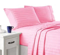 light pink striped hotel-style bedsheets