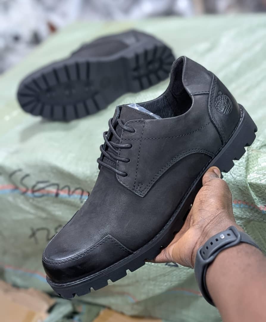 Black rugged low-cut leather lace-up shoe