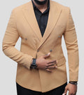 A tan, double-breasted peak lapel blazer