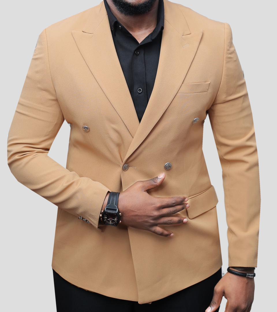 A tan, double-breasted peak lapel blazer