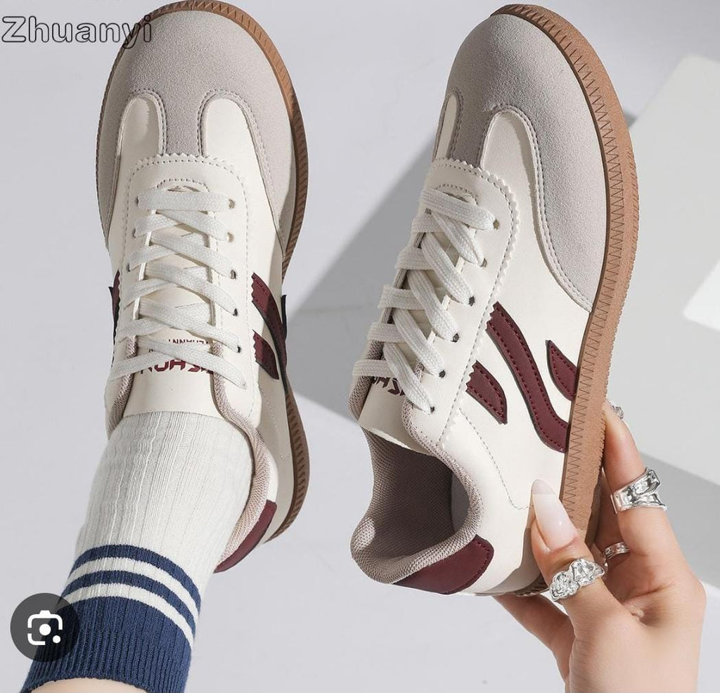 Retro-style, low-top white fashion sneakers