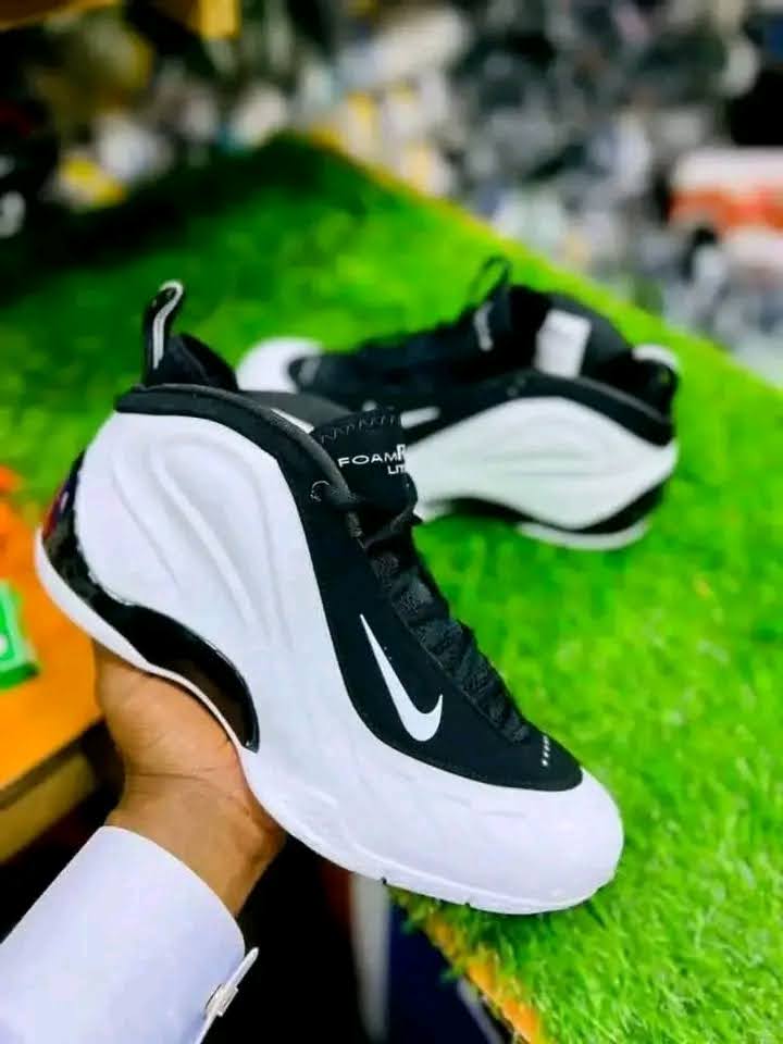 Black-and-white Nike Foamposite Lite sneakers