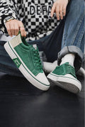 Low-top green canvas skateboard sneakers