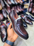 Dark brown leather penny loafer dress shoe