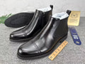 Black leather wingtip brogue side-zip boot