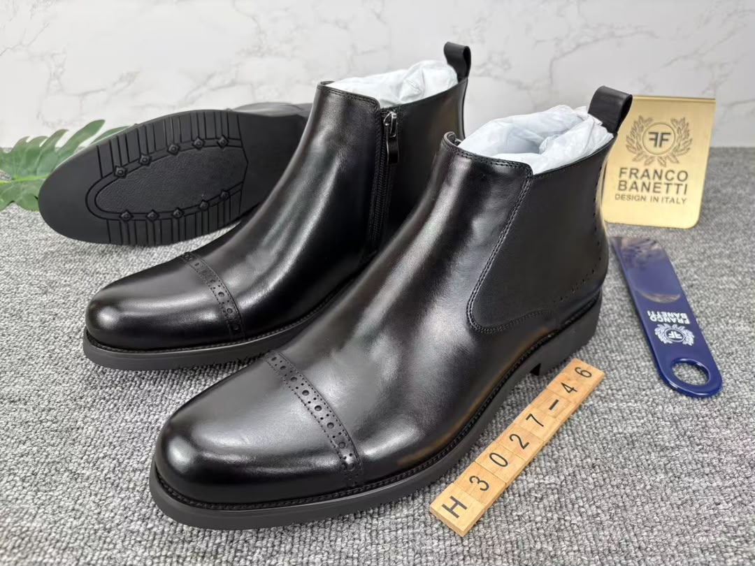 Black leather wingtip brogue side-zip boot