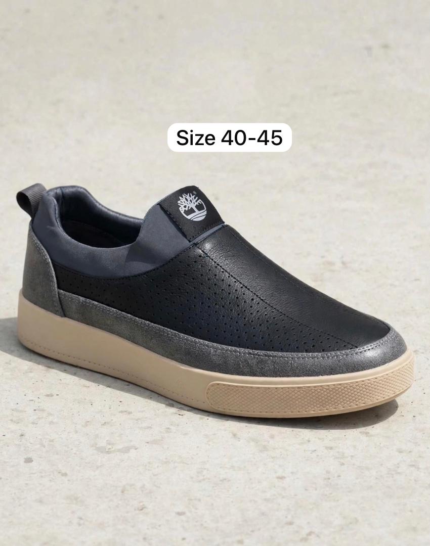 Black perforated leather slip-on sneakers