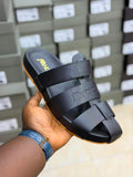 JW Anderson branded black leather multi-strap slide sandals