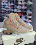 Beige or khaki variation of the Nike Air Jordan 6 sneaker