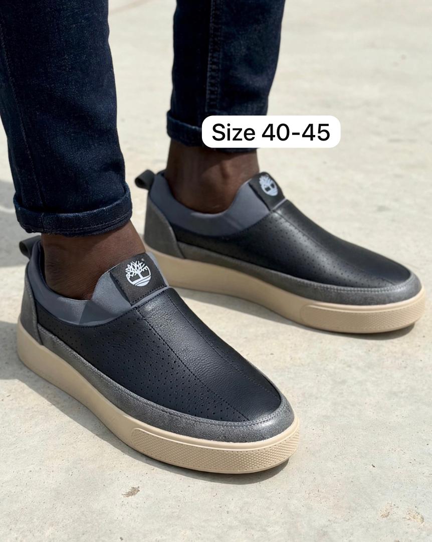Black perforated leather slip-on sneakers